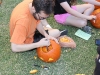 Abe carving a jack-o-lantern